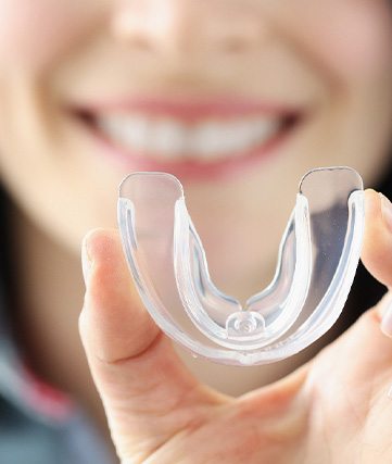 Frisco patient showing off a mouthguard